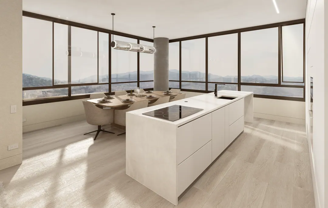 Cocina italiana con isla y comedor frente a ventanales